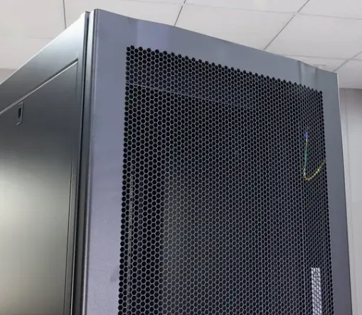 Network rack cabinet with perforated door and grounding details