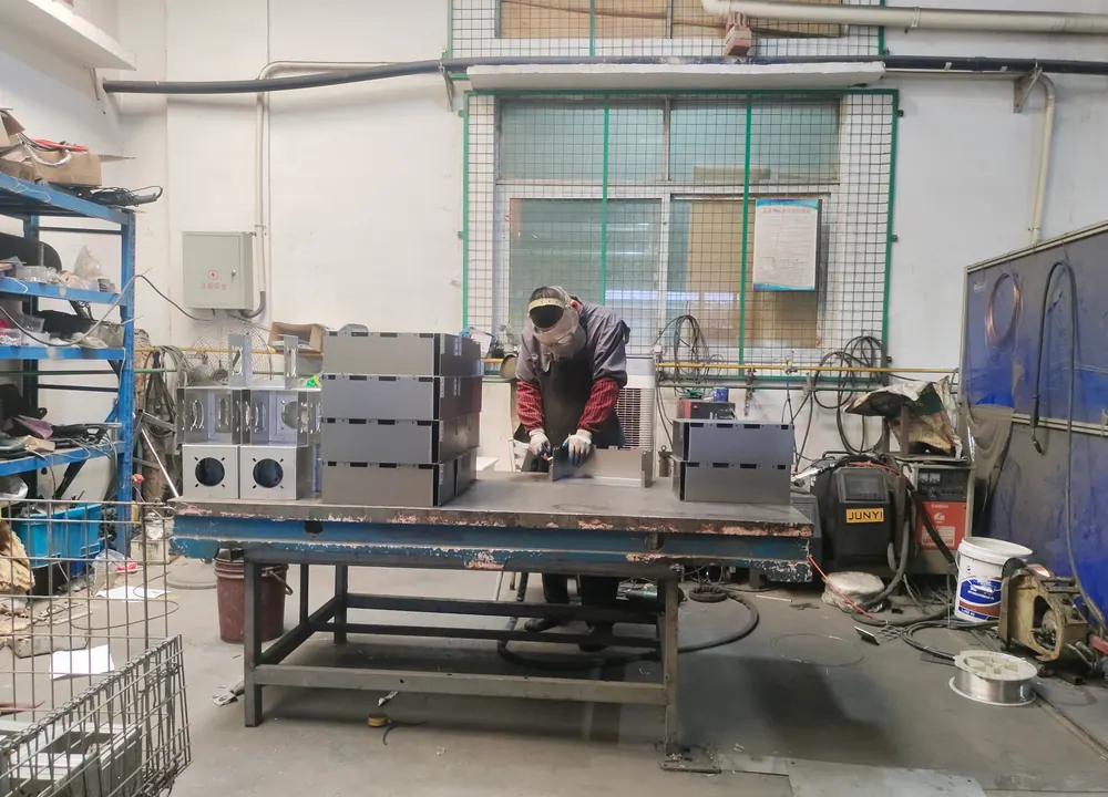 Batch inspection of fabricated metal enclosures after welding