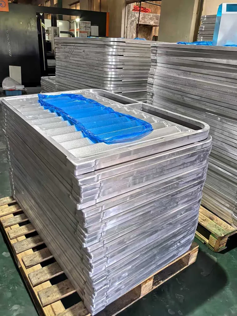 Aluminium framed livestock panels stacked on a pallet in the factory