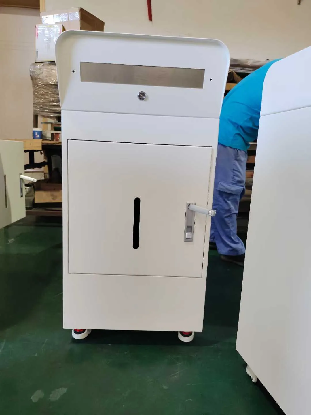 Assembled custom metal cabinet with lock door and caster feet checked before packing