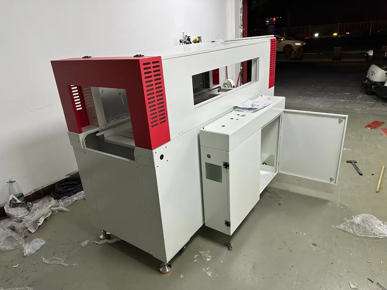 Assembled custom metal cabinet fit check with doors vents hinges and access panels visible