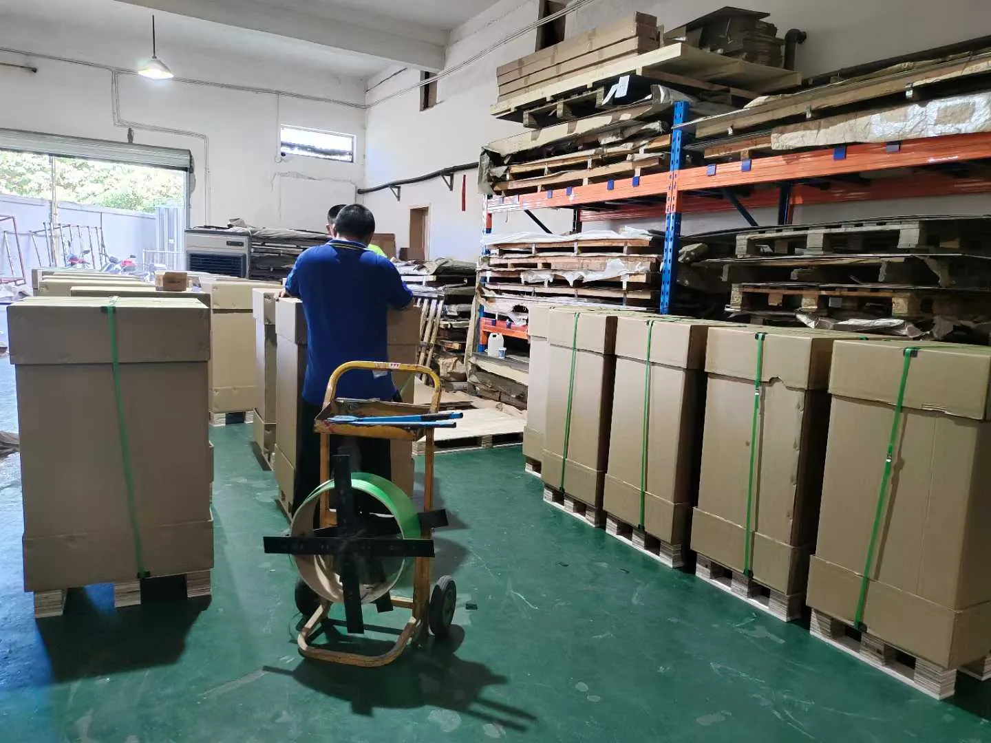 Custom metal cabinets packed on pallets with cartons and plastic straps in Fulei Metal workshop
