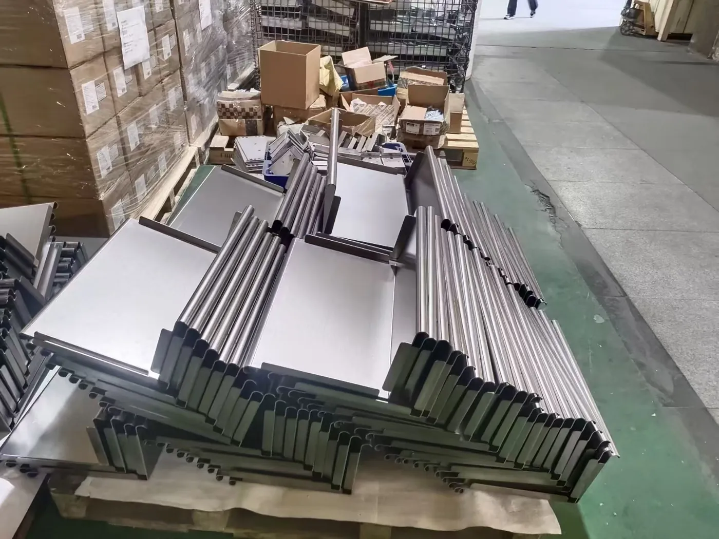 Formed sheet metal panels staged in job order after bending