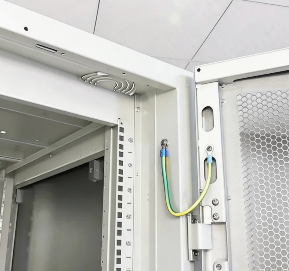 Network cabinet grounding wire hinge and rack rail detail