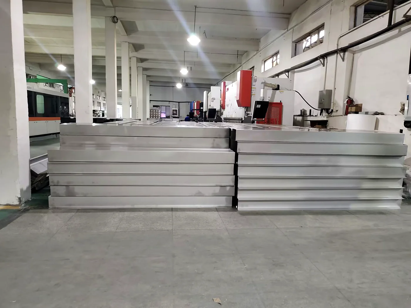 Sheet metal raw material stock staged before laser cutting at Fulei Metal