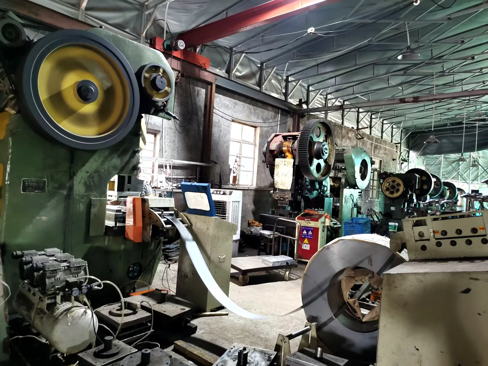 Stamping machine running a production batch of sheet metal components