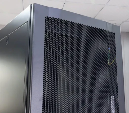 Perforated vent panel fitted to an enclosure side