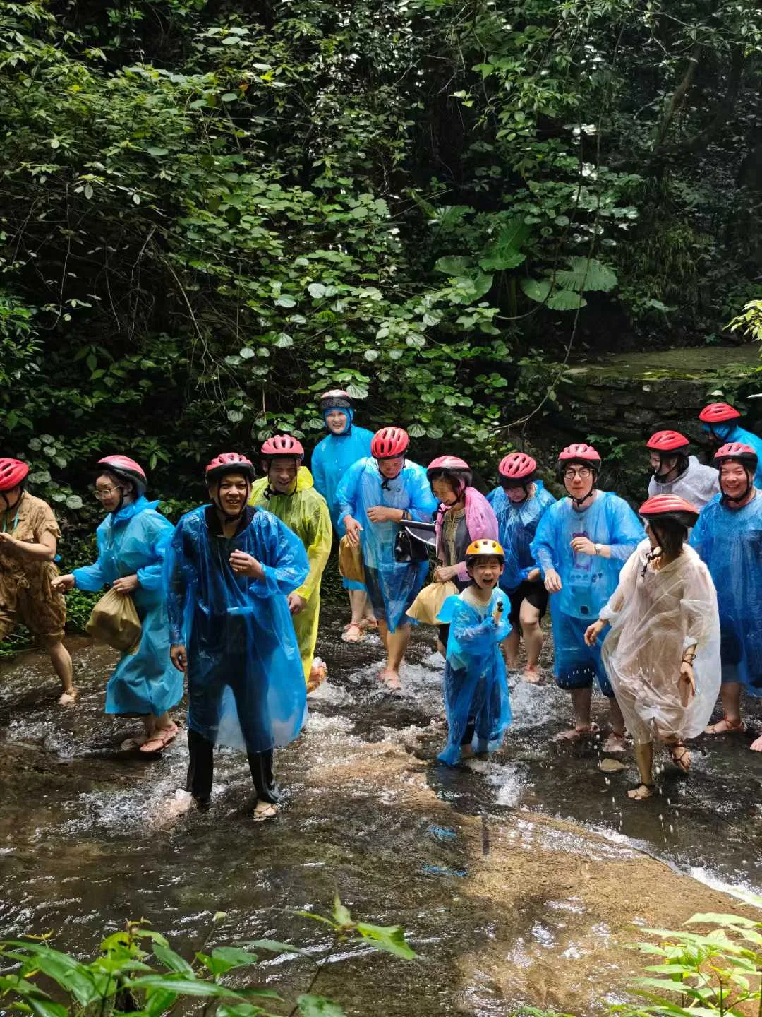 Fulei Metal team hiking through Guilin streams — 2025 team-building trip